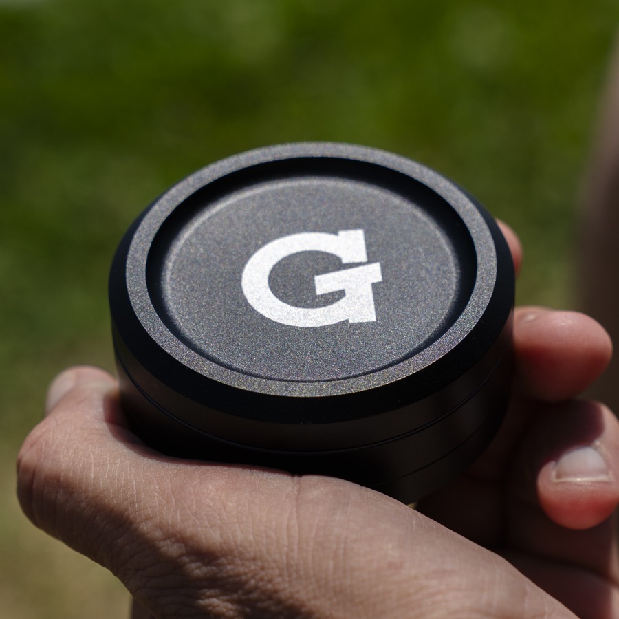 Hand holding the closed G Pen Grinder