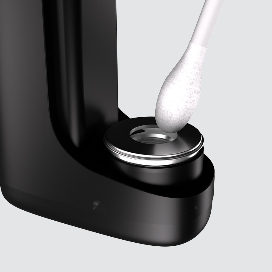 Cotton swab cleaning the cartridge connection point