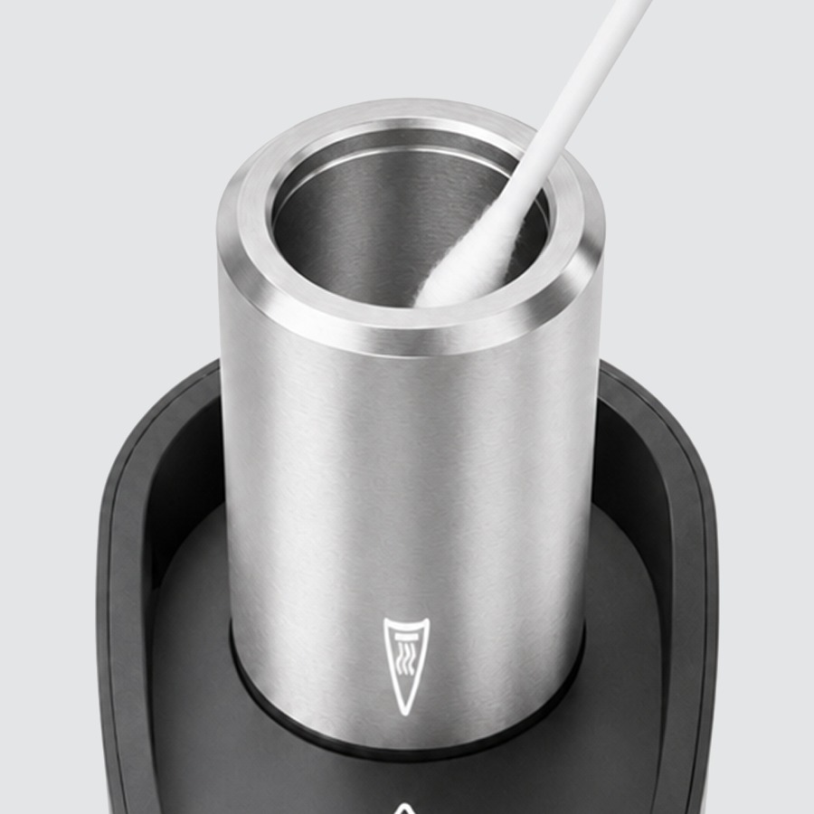 Cleaning the Micro II ceramic heating chamber with a cotton swab